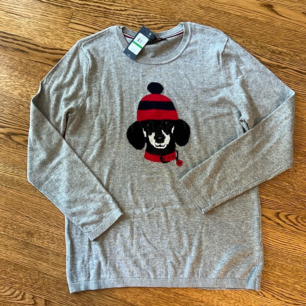 Tommy crew neck sweater with original tags. Gray back ground size large